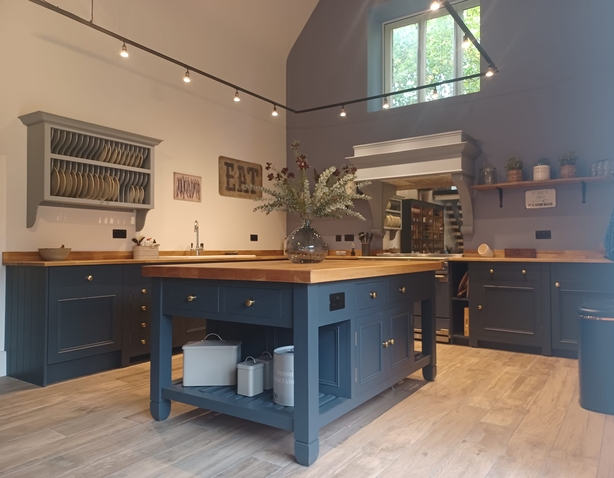 Kitchen painted in blue to illustrate colourful cabinets and walls trend