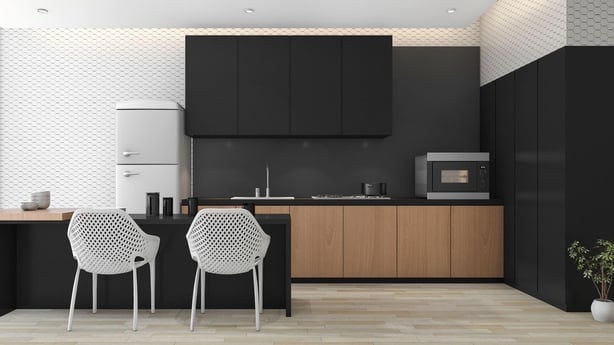 Black kitchen illustrating moody and expressive trend