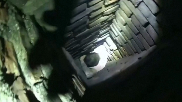 Firefighters had to knock out bricks to free the man