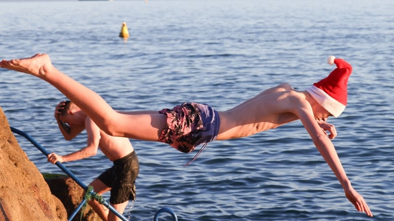 Thousands brave the cold for Christmas Day swims