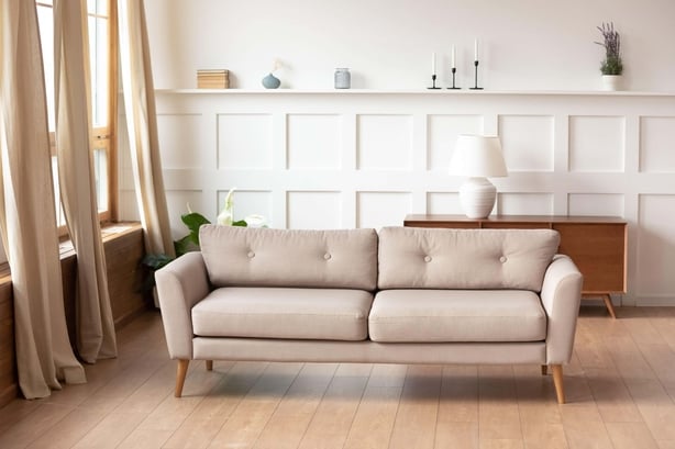 Modern living room with wooden flooring and cabinetry