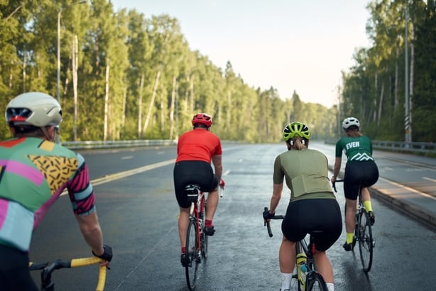Man cycling at sunset, Corsica, France