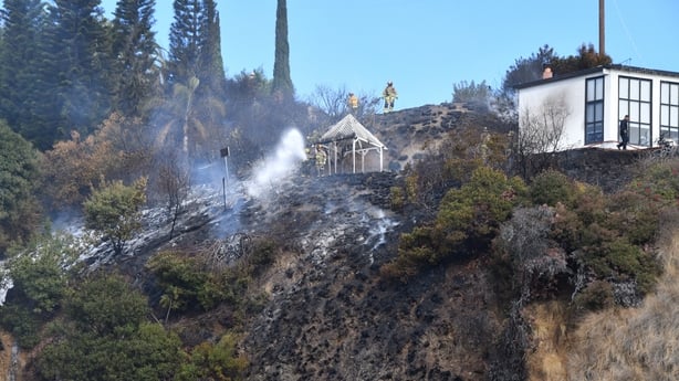 Homes scorched by wildfire on Sunset Boulevard