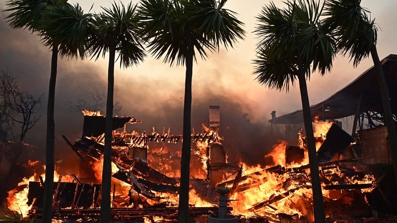 LA wildfires devour more homes even as fierce winds ease