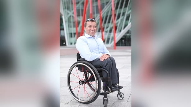 John Fulham discussing wheelchair accessibility