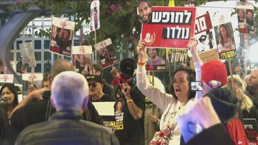 People gather in Tel Aviv awaiting news of ceasefire deal