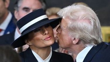 Donald and Melania Trump share awkward air kiss
