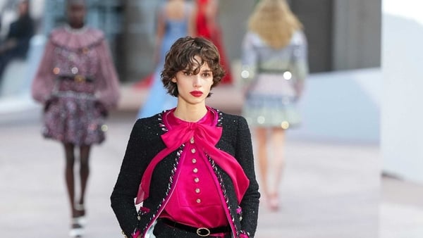 Chanel brought back Eighties shoulder pads and pussy bows (Lewis Joly/AP)