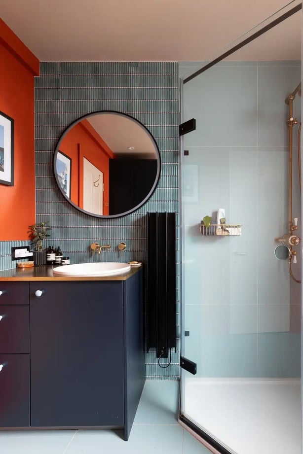 Streamlined vanity features complement a bold contemporary bathroom scheme in this bathroom by Absolute Project Management (Absolute Project Management/Helen Rayner of Moon Street Studio/PA)