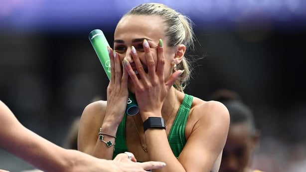 Ireland's Sharlene Mawdsley reacts after crossing the finish line in the women's 4x400m relay heat of the athletics event at the Paris 2024 Olympic Games