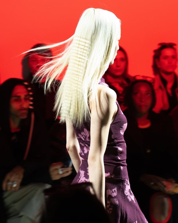A model walking at the Chet Lo show