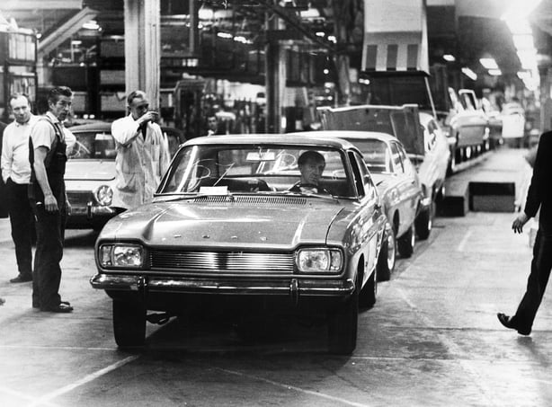 A new Ford Capri car rolls off the production line at the Ford Motor plant in Halewood, Merseyside. January 1969.