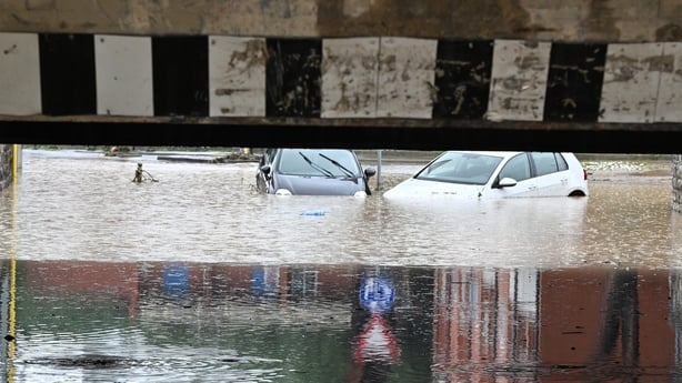 Cars are submerged in water following the flooding in Florence