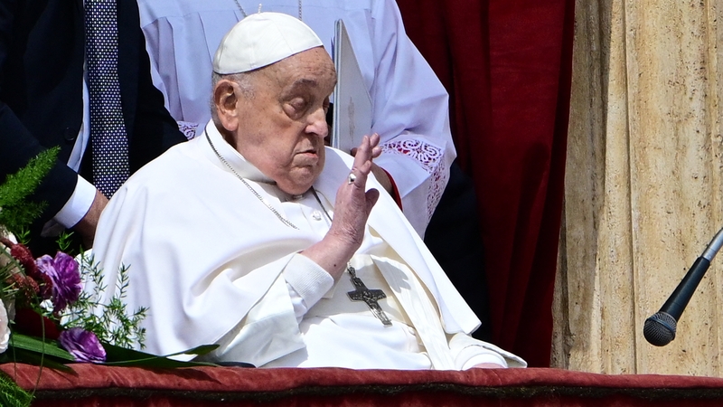 Pope Francis waved to the gathered crowds from the balcony