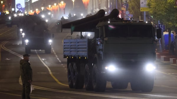 A Russian officer looks at drones installed on a military truck, riding along Tvesrkaya street during the rehearsals of the Victory Day Red Square Parade