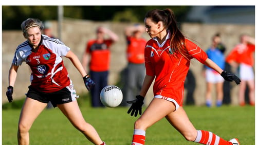 Amy Ryan drives forward during a club championship game in the colours of her club Oola